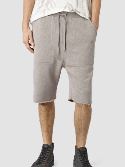 Close-up: Lightweight running shorts with clean stitching. Athletic garment in a subtle grey marl, showcasing a 5-inch inseam