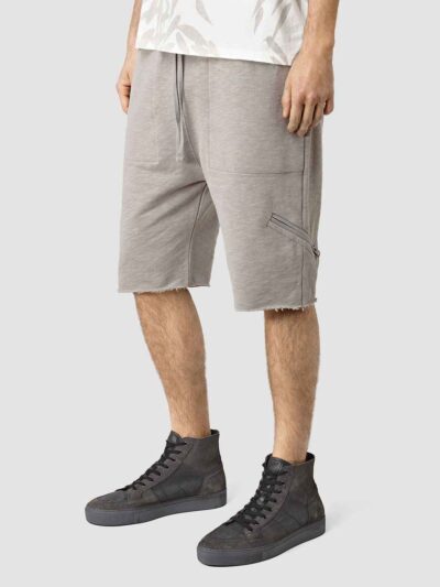 Close-up: Lightweight running shorts with clean stitching. Athletic garment in a subtle grey marl, showcasing a 5-inch inseam
