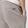 Close-up: Lightweight running shorts with clean stitching. Athletic garment in a subtle grey marl, showcasing a 5-inch inseam