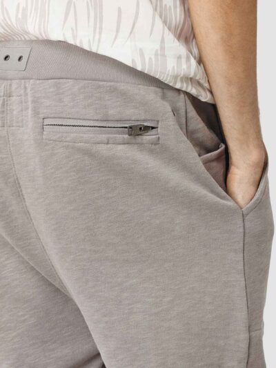 Close-up: Lightweight running shorts with clean stitching. Athletic garment in a subtle grey marl, showcasing a 5-inch inseam