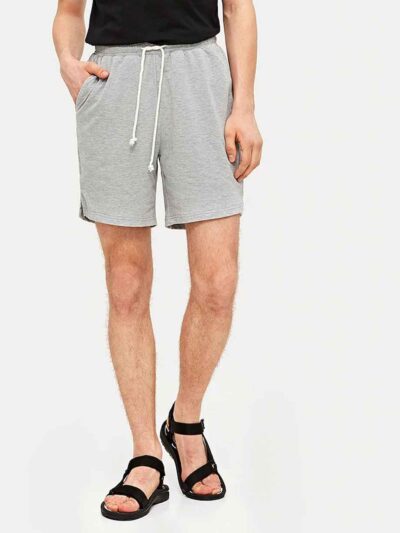 Vibrant, custom printed beach shorts with ocean blue hues. Lightweight, quick-drying fabric, durable stitching. Perfect summe
