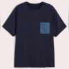 Soft, custom-designed t-shirt with a fabric pocket. Heavyweight cotton, clean stitching, casual style. Indigo blue tones with