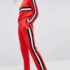 Colour block tracksuit with distinctive seams. Relaxed fit trousers and top, featuring bold contrasts. Notice the smooth fabr