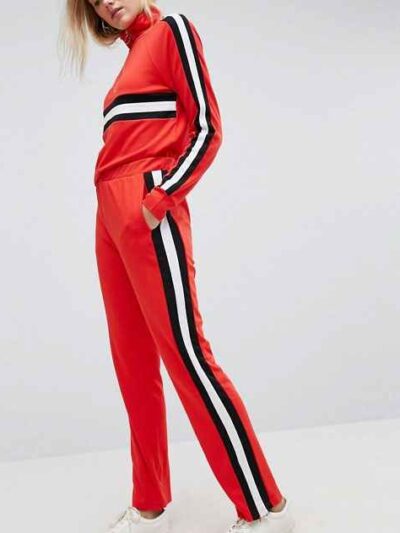 Colour block tracksuit with distinctive seams. Relaxed fit trousers and top, featuring bold contrasts. Notice the smooth fabr