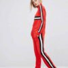 Colour block tracksuit with distinctive seams. Relaxed fit trousers and top, featuring bold contrasts. Notice the smooth fabr
