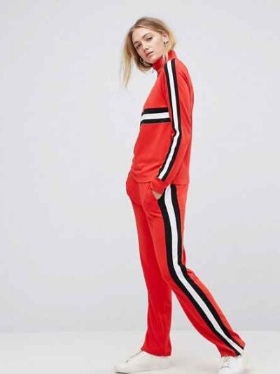 Colour block tracksuit with distinctive seams. Relaxed fit trousers and top, featuring bold contrasts. Notice the smooth fabr