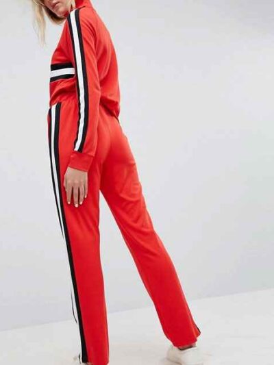 Colour block tracksuit with distinctive seams. Relaxed fit trousers and top, featuring bold contrasts. Notice the smooth fabr