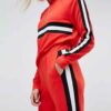 Colour block tracksuit with distinctive seams. Relaxed fit trousers and top, featuring bold contrasts. Notice the smooth fabr