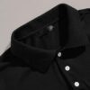 Men's polo shirt with a vibrant digital print. Close-up shows soft, breathable knit texture and neat collar stitching. Colorf