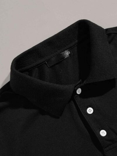 Men's polo shirt with a vibrant digital print. Close-up shows soft, breathable knit texture and neat collar stitching. Colorf