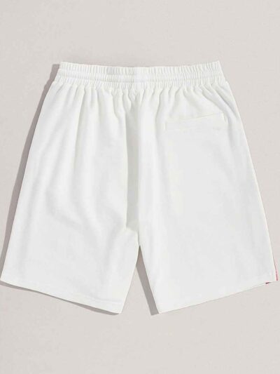Textured cotton shorts, vibrant custom embroidery detail. Casual streetwear, available in varied colors. Note durable stitchi