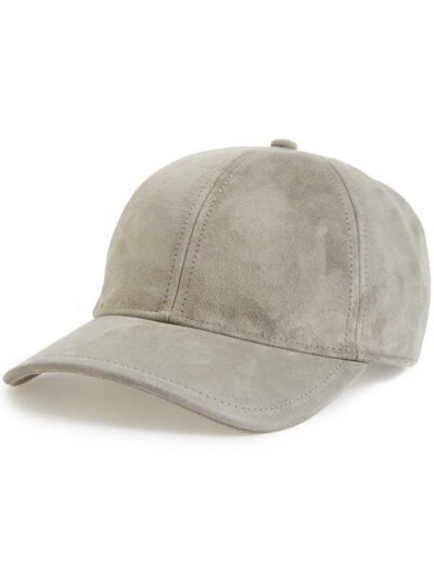 Navy trucker cap with custom text embroidery. Woven front, breathable mesh back, adjustable snap closure. Close-up shows deta