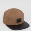 Close-up of custom baseball cap. Embroidered design, curved brim, adjustable back. Textured twill fabric, vibrant colors, dur