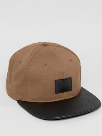 Close-up of custom baseball cap. Embroidered design, curved brim, adjustable back. Textured twill fabric, vibrant colors, dur