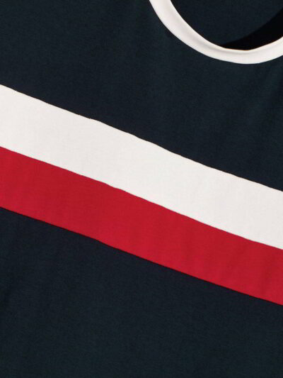 Close-up of a smooth cotton t-shirt, vivid graphic print. Double-stitched seams visible, soft, breathable fabric texture. Gar