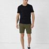 Men's heavy cotton apparel set: tee and shorts. Notice the dense weave, sturdy seams. Relaxed fit, casual style, likely beige