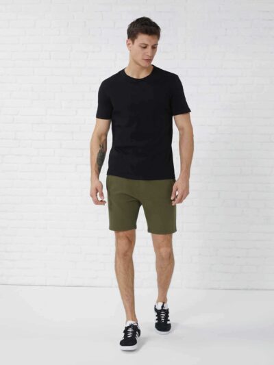 Men's heavy cotton apparel set: tee and shorts. Notice the dense weave, sturdy seams. Relaxed fit, casual style, likely beige