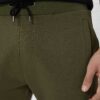 Men's heavy cotton apparel set: tee and shorts. Notice the dense weave, sturdy seams. Relaxed fit, casual style, likely beige