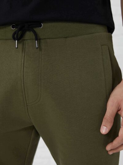 Men's heavy cotton apparel set: tee and shorts. Notice the dense weave, sturdy seams. Relaxed fit, casual style, likely beige