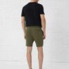 Men's heavy cotton apparel set: tee and shorts. Notice the dense weave, sturdy seams. Relaxed fit, casual style, likely beige