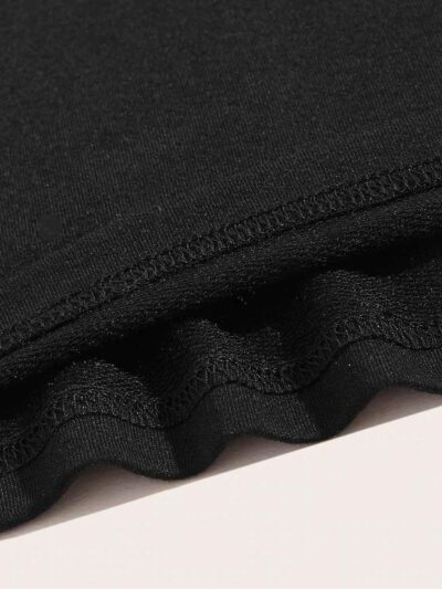 Close-up of heavyweight French Terry cotton gym shorts. Visible texture, clean stitching, relaxed fit. Hints of a light heath