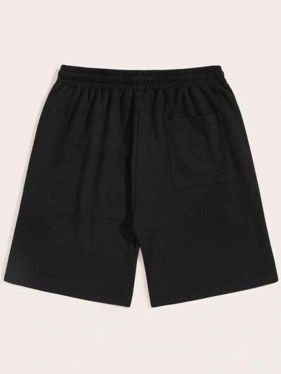 Close-up of heavyweight French Terry cotton gym shorts. Visible texture, clean stitching, relaxed fit. Hints of a light heath