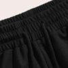 Close-up of heavyweight French Terry cotton gym shorts. Visible texture, clean stitching, relaxed fit. Hints of a light heath