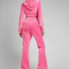 Heather gray women's jogger and hoodie set. Soft, looped knit with subtle embroidery detail. Casual athletic wear. Comfortabl