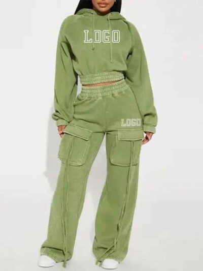 Close-up of a cotton women's tracksuit set in warm autumn hues. Soft, textured knit with detailed stitching. Relaxed fit, cus