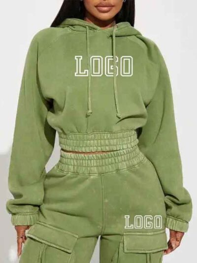 Close-up of a cotton women's tracksuit set in warm autumn hues. Soft, textured knit with detailed stitching. Relaxed fit, cus