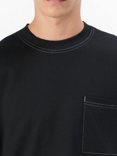 Black oversized t-shirt with contrast white stitching, drop shoulders, pocket. Soft, textured fabric. Custom logo imprint are