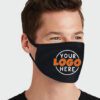 Close-up of a custom face mask. Soft fabric, clean stitching. Personalized logo detail. Protective, reusable mouth cover. - V