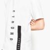 Men's stylish t-shirt, likely cotton. Close-up shows custom logo print. Fine stitching details on the navy blue collar and sl