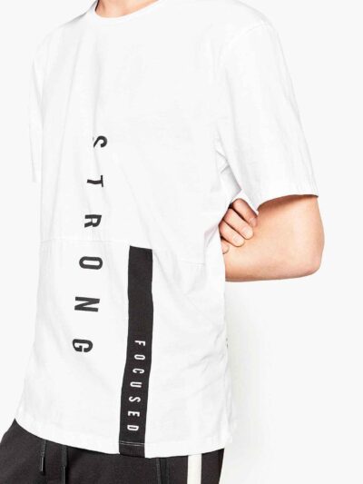 Men's stylish t-shirt, likely cotton. Close-up shows custom logo print. Fine stitching details on the navy blue collar and sl