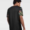 Lightweight tee with vibrant tropical print pocket. Soft cotton, neat stitching. Casual short-sleeve shirt, summery vibe. - V