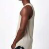 Heather grey muscle tank top wholesale. Sleeveless, raw edge armholes, relaxed fit. Notice the finely knitted soft cotton tex