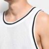 Close-up of a sleek, light grey performance tank top. Notice the fine, breathable knit fabric & reinforced stitching. Perfect