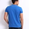 Close-up: Textured navy polo shirt, pique knit, clean stitching. Customization-ready. Breathable, durable fabric. Bulk polo s