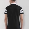 Close-up of a navy polo shirt showcasing fine pique knit texture, clean stitching. Short-sleeved, classic collar, perfect for