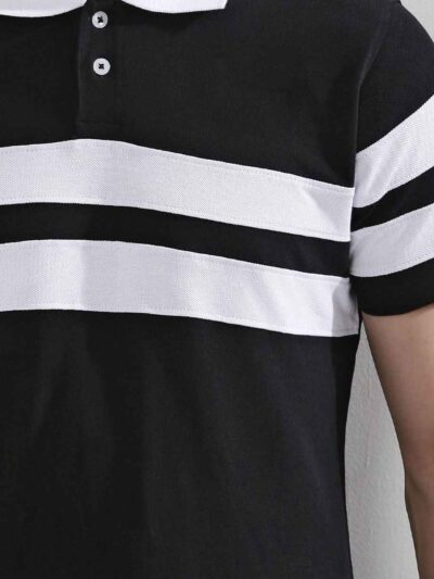 Close-up of a navy polo shirt showcasing fine pique knit texture, clean stitching. Short-sleeved, classic collar, perfect for