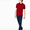 Close-up of hospitality polo shirt. Breathable knit fabric, fine stitching. Burgundy color with subtle contrast collar detail