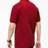 Close-up of hospitality polo shirt. Breathable knit fabric, fine stitching. Burgundy color with subtle contrast collar detail