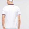 Close-up of navy polo shirt. Fine pique knit, clean stitching detail. Business casual team uniform. Breathable & durable. - V