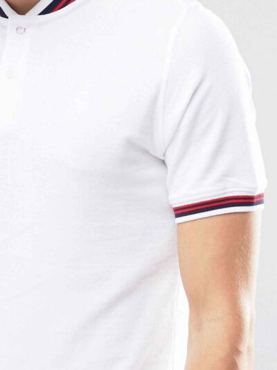 Close-up of navy polo shirt. Fine pique knit, clean stitching detail. Business casual team uniform. Breathable & durable. - V