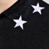 Close-up of a custom polo shirt, fine-knit pique fabric, neat stitching. Shows classic collar, short sleeves, school uniform