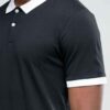 Close-up of a well-stitched polo shirt with button placket. Notice the textured fabric and durable construction, hints of nav