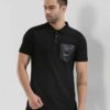 Close-up of a navy polo shirt, embroidered logo detail on chest, subtle pique knit texture, clean, precise stitching. - View