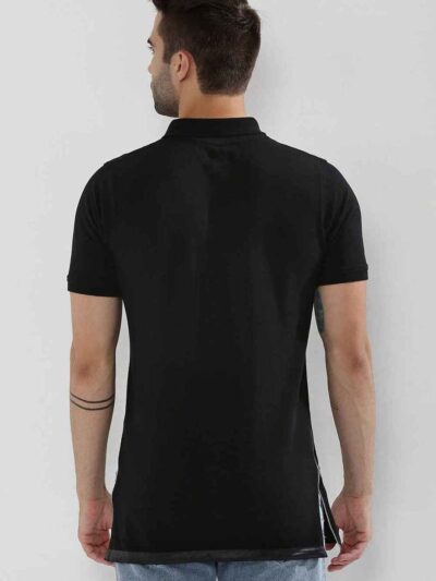 Close-up of a navy polo shirt, embroidered logo detail on chest, subtle pique knit texture, clean, precise stitching. - View