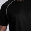 Men's oversized tee and shorts set, textured fabric, custom embroidery detail. Relaxed fit, soft drape. Likely cotton blend,