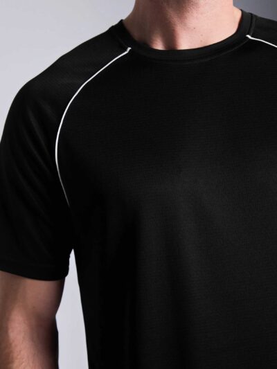 Men's oversized tee and shorts set, textured fabric, custom embroidery detail. Relaxed fit, soft drape. Likely cotton blend,